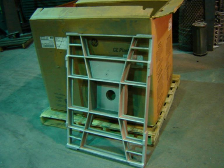 713 aluminum casting leaning up against a cardboard box in a warehouse