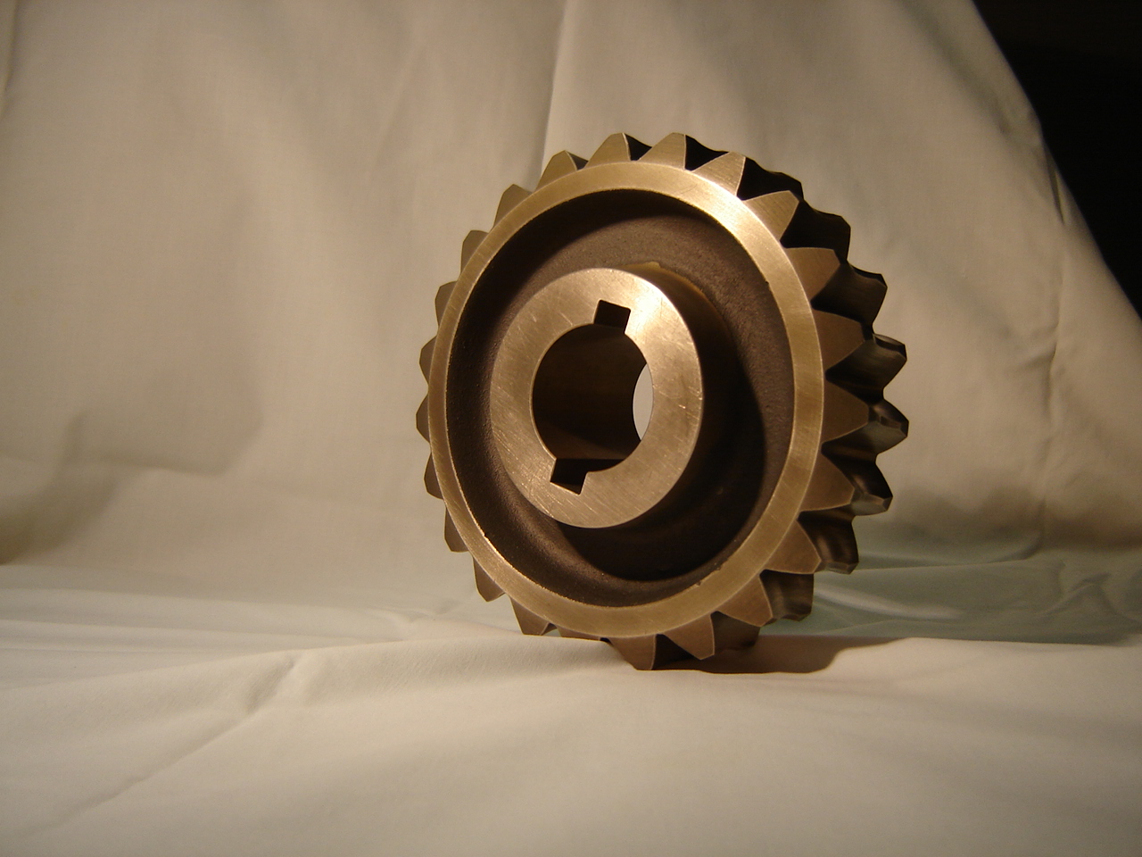 Aluminum bronze gear sitting on top of a white sheet