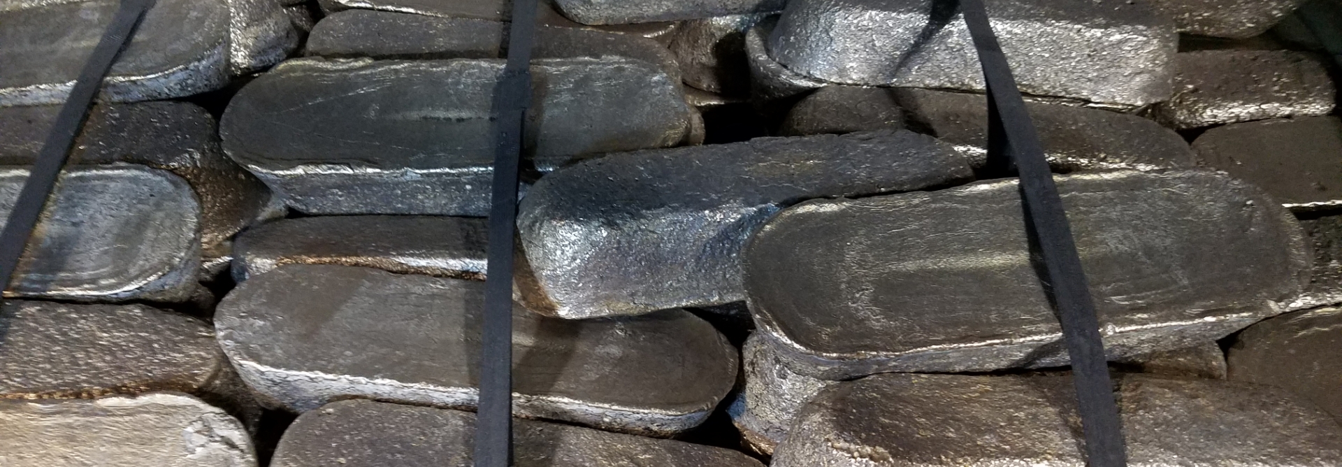 Blocks of aluminum alloys strapped into rows
