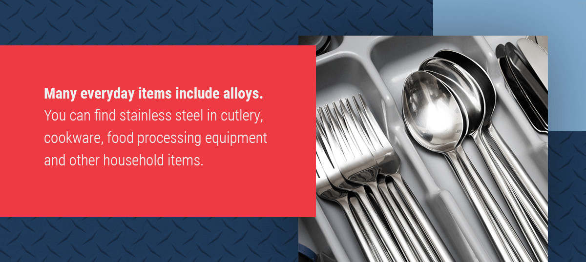 Kitchen utensils like forks, spoons, and knives in a drawer to show that many everyday items contain alloys
